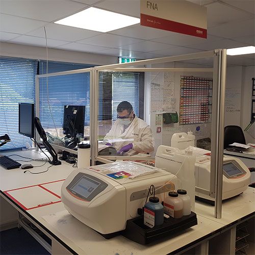 Perspex sneeze screens with clear acrylic, used in a lab environment. 